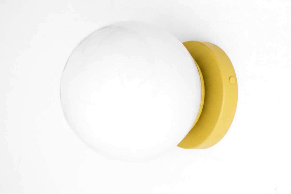 Mid-century modern wall sconce with white globe and yellow circular base. - SCONCE MODEL NO. 3825