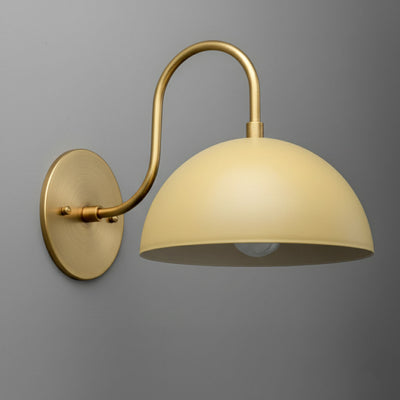Antique brass wall sconce with smooth cream dome shade and curved arm mounting. - SCONCE MODEL NO. 9092
