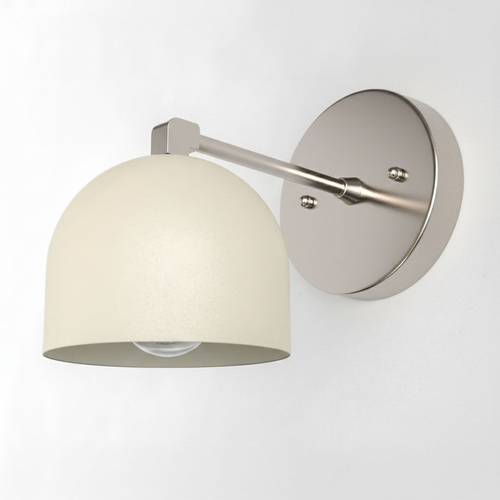 Brushed nickel wall sconce with cream dome-shaped shade and minimalist arm design. - SCONCE MODEL NO. 8704