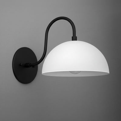 Black metal wall sconce with a curved arm and a smooth white dome-shaped shade. - SCONCE MODEL NO. 9092