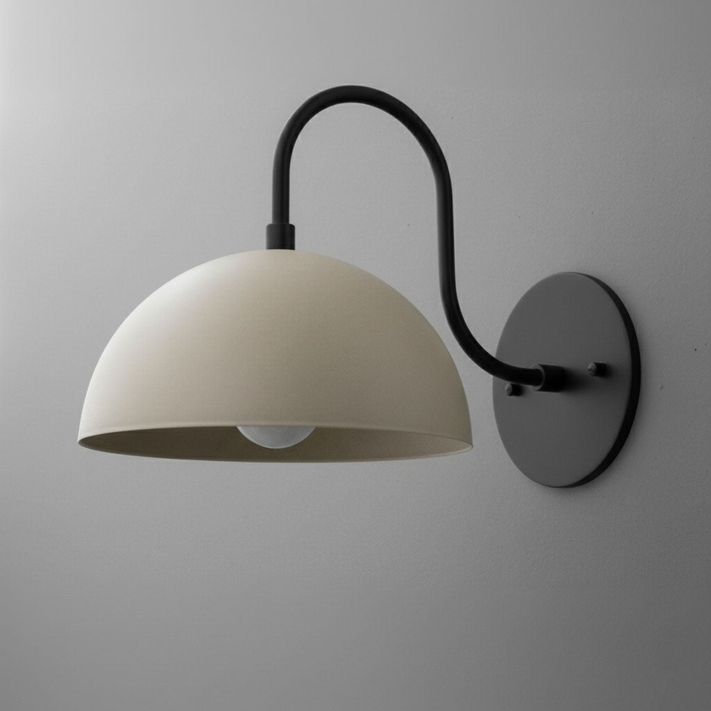Wall-mounted matte black metal sconce with smooth cream dome shade and exposed bulb. - SCONCE MODEL NO. 9092