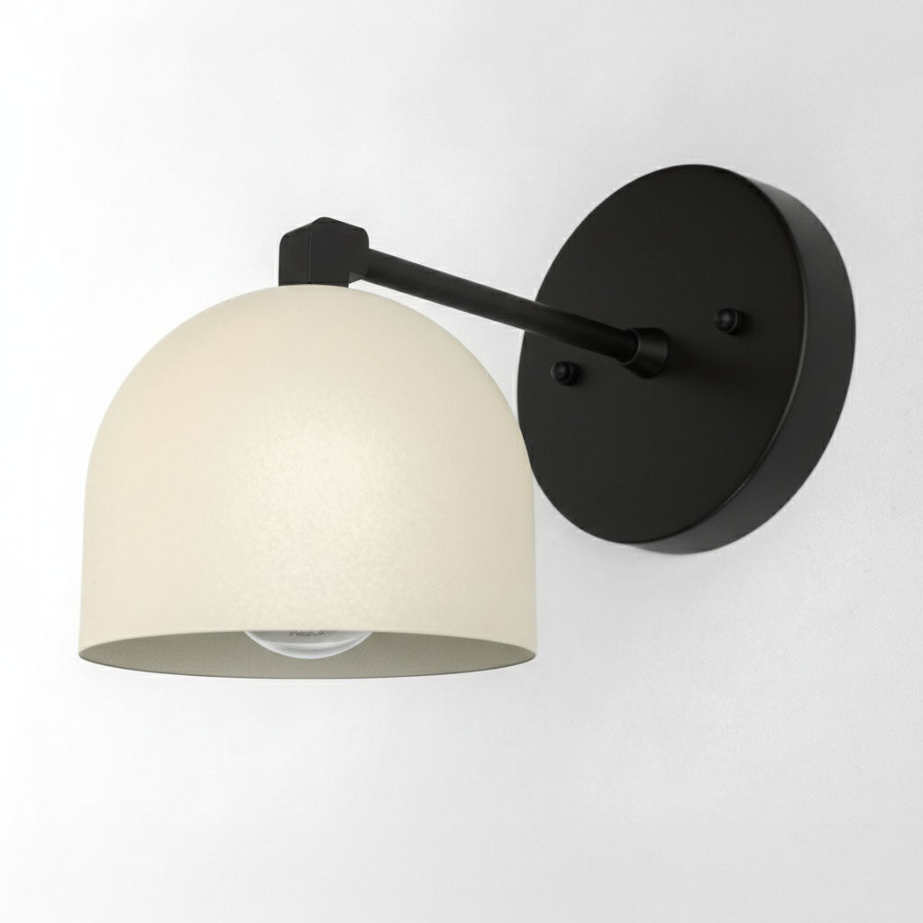 Black wall sconce with matte cream dome shade and round black mounting plate. - SCONCE MODEL NO. 8704