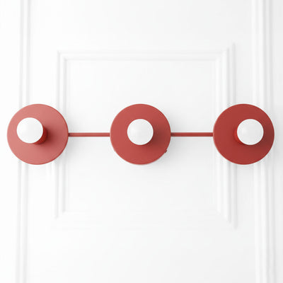 Brick red mid-century modern vanity light with three exposed bulbs and circular metal backplates. - VANITY LIGHT MODEL NO. 5708