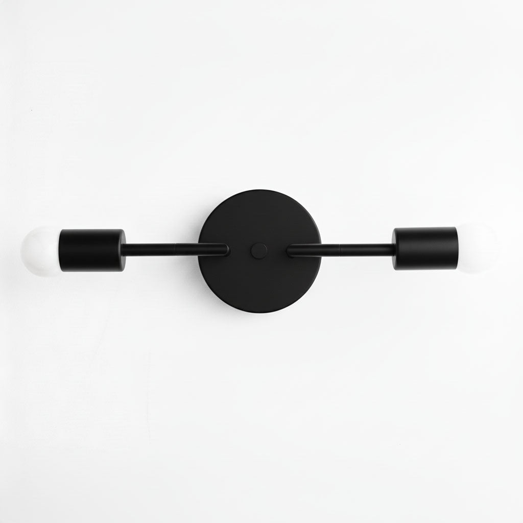 Mid-century modern black vanity light with two bare bulbs and round wall mount. - VANITY LIGHT MODEL NO. 1938