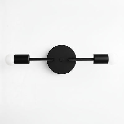 Mid-century modern black vanity light with two bare bulbs and round wall mount. - VANITY LIGHT MODEL NO. 1938