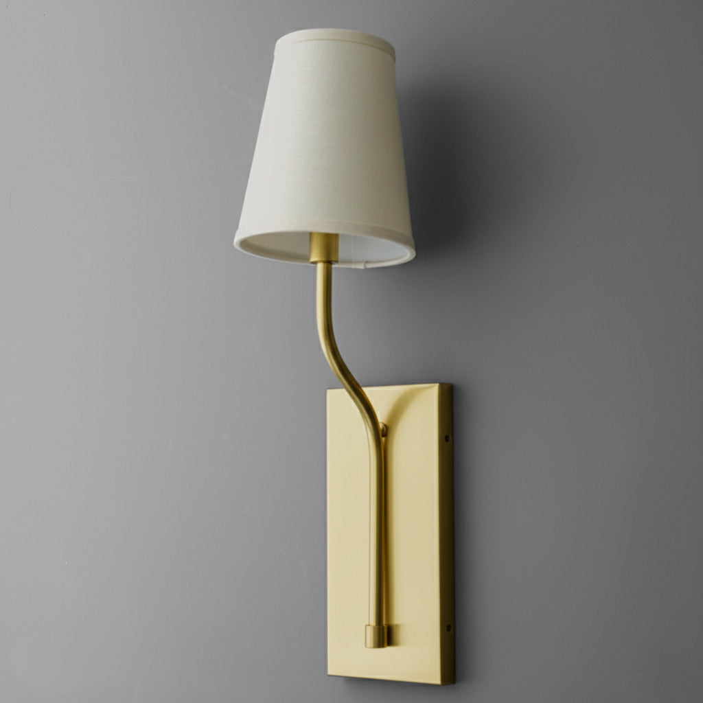Brushed brass single-bulb wall sconce with curved arm and tapered white fabric shade. - SCONCE MODEL NO. 9714