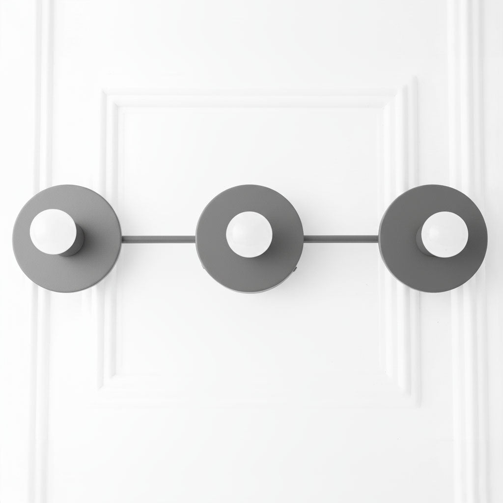 Mid-century modern black three-bulb vanity light with round backplates and exposed bulbs. - VANITY LIGHT MODEL NO. 5708