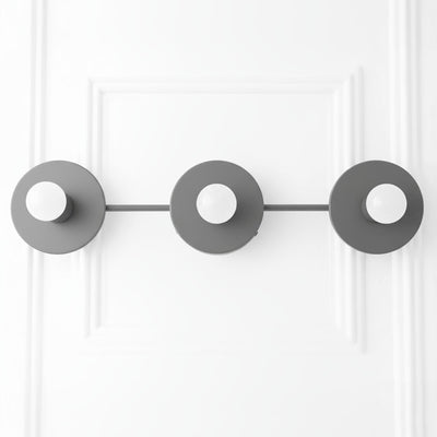 Mid-century modern black three-bulb vanity light with round backplates and exposed bulbs. - VANITY LIGHT MODEL NO. 5708