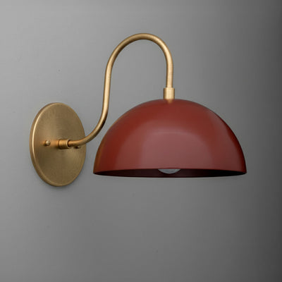 Antique brass wall sconce with curved arm and dome-shaped brick red shade. - SCONCE MODEL NO. 9092