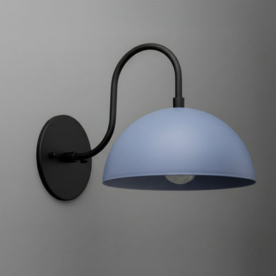 Wall sconce with black metal arm and round periwinkle dome shade mounted on gray wall. - SCONCE MODEL NO. 9092