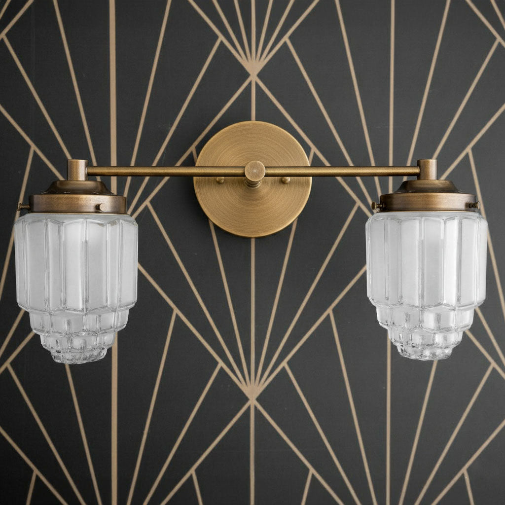 Antique brass two-bulb vanity light with ribbed globe glass shades and round wall mount. - VANITY LIGHT MODEL NO. 9777