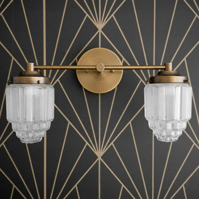 Antique brass two-bulb vanity light with ribbed globe glass shades and round wall mount. - VANITY LIGHT MODEL NO. 9777