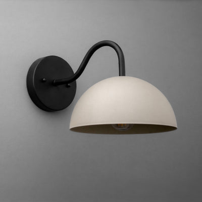 Black metal wall sconce with curved arm and large white dome-shaped shade. - SCONCE MODEL NO. 6678