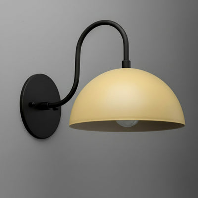 Antique brass wall sconce with cream dome shade and curved arm mount. - SCONCE MODEL NO. 9092