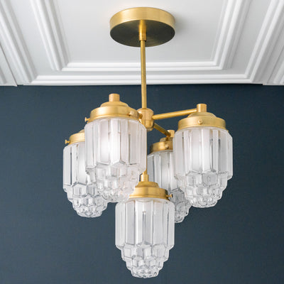 Raw brass chandelier with four tiered textured glass globes in Art Deco style. - CHANDELIER MODEL NO. 0777