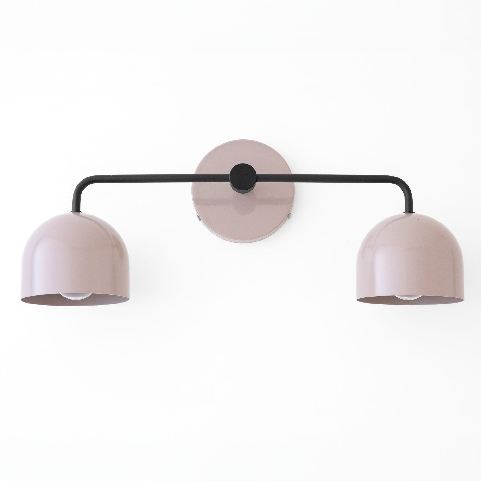 Mid-century modern vanity light with two soft pink dome shades and black horizontal arm. - VANITY LIGHT MODEL NO. 2082