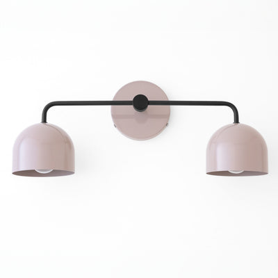 Mid-century modern vanity light with two soft pink dome shades and black horizontal arm. - VANITY LIGHT MODEL NO. 2082