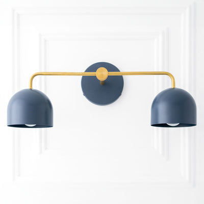 Scandinavian-style vanity light with two deep blue dome shades and a brass-finished horizontal bar. - VANITY LIGHT MODEL NO. 2082