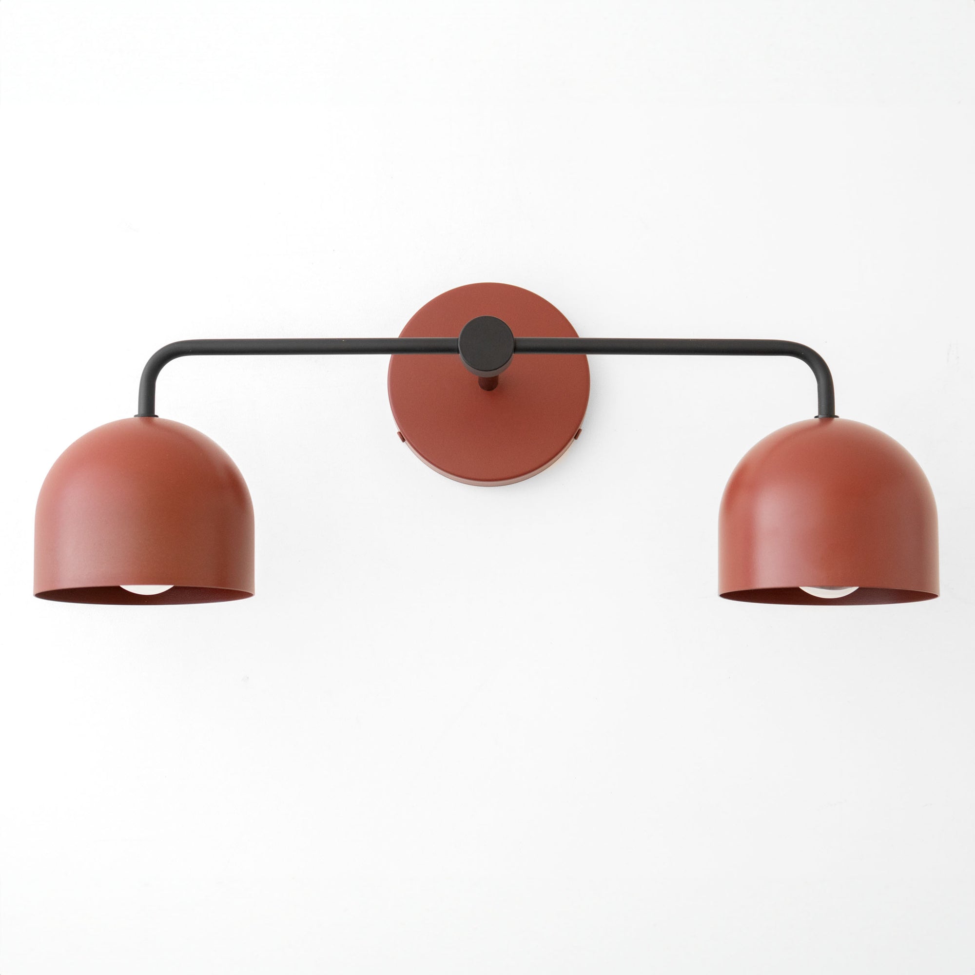 Mid-century modern vanity light with two deep terracotta dome shades and matte black metal frame. - VANITY LIGHT MODEL NO. 2082