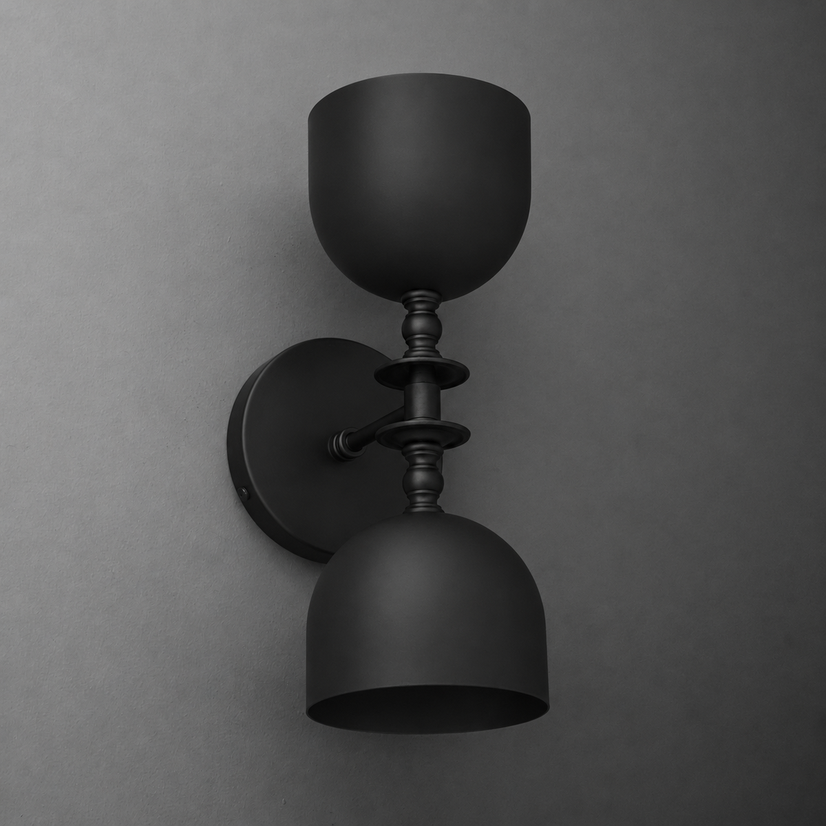 Matte black two-bulb wall sconce with symmetrical dome shades and decorative central stem. - SCONCE MODEL NO. 6995