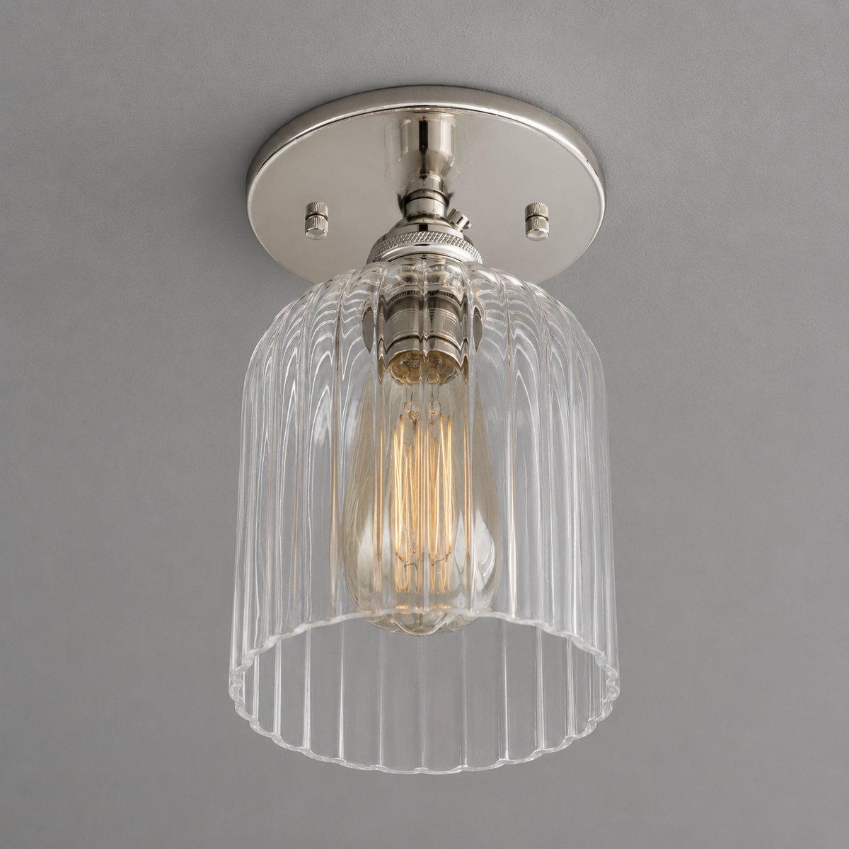 Single-light ceiling light in Polished Nickel with a ribbed glass bell shade around an exposed bulb, mounted on a round canopy. - CEILING LIGHT MODEL NO. 1116