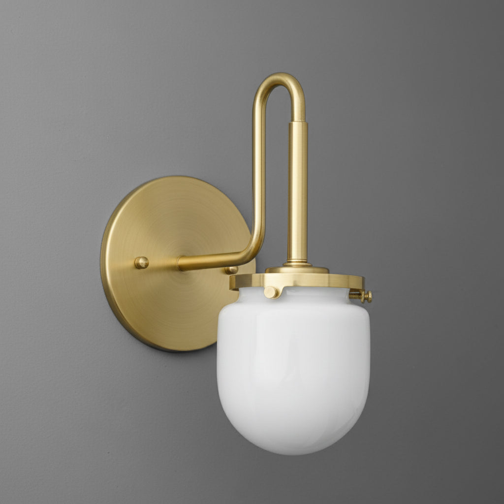 Wall-mounted brass sconce with frosted white glass globe shade and curved support arm. - SCONCE MODEL NO. 2819