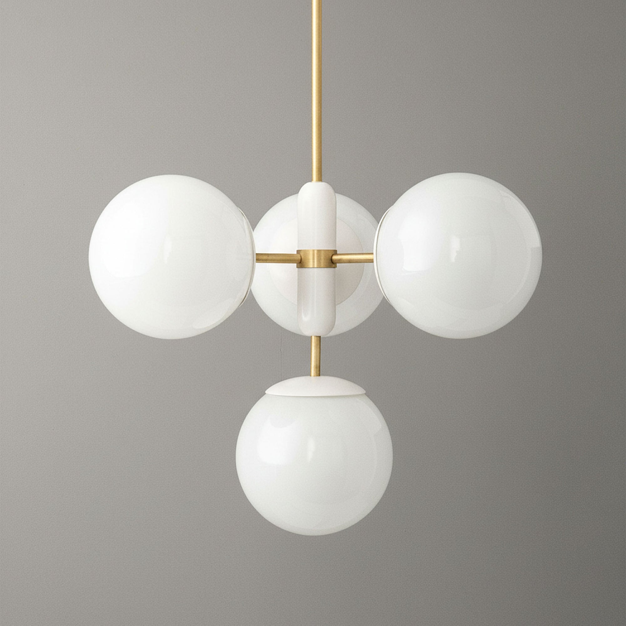 Art Deco chandelier with sealed brass finish and four white glass globes suspended on vertical rod. - CHANDELIER MODEL NO. 4321