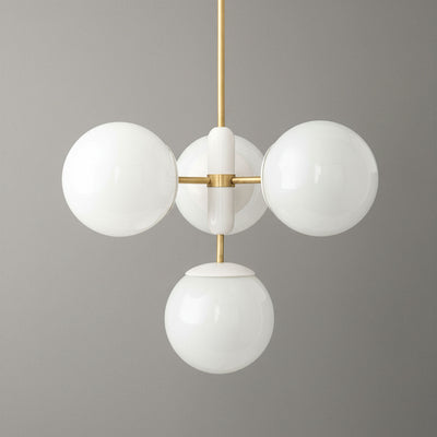 Art Deco chandelier with sealed brass frame and four white globe lights against gray background. - CHANDELIER MODEL NO. 4321