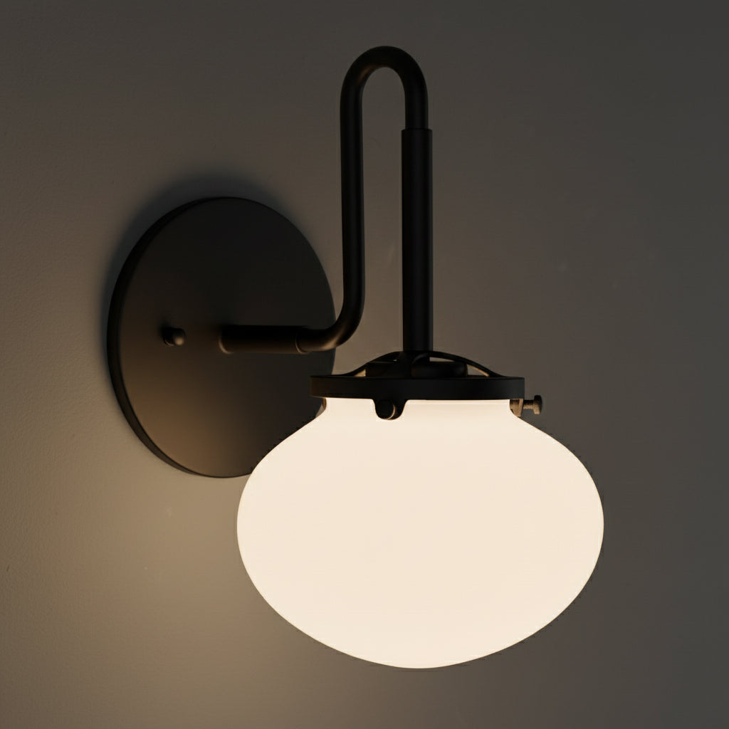 Black metal wall sconce with rounded white frosted glass shade and single bulb design. - SCONCE MODEL NO. 9452