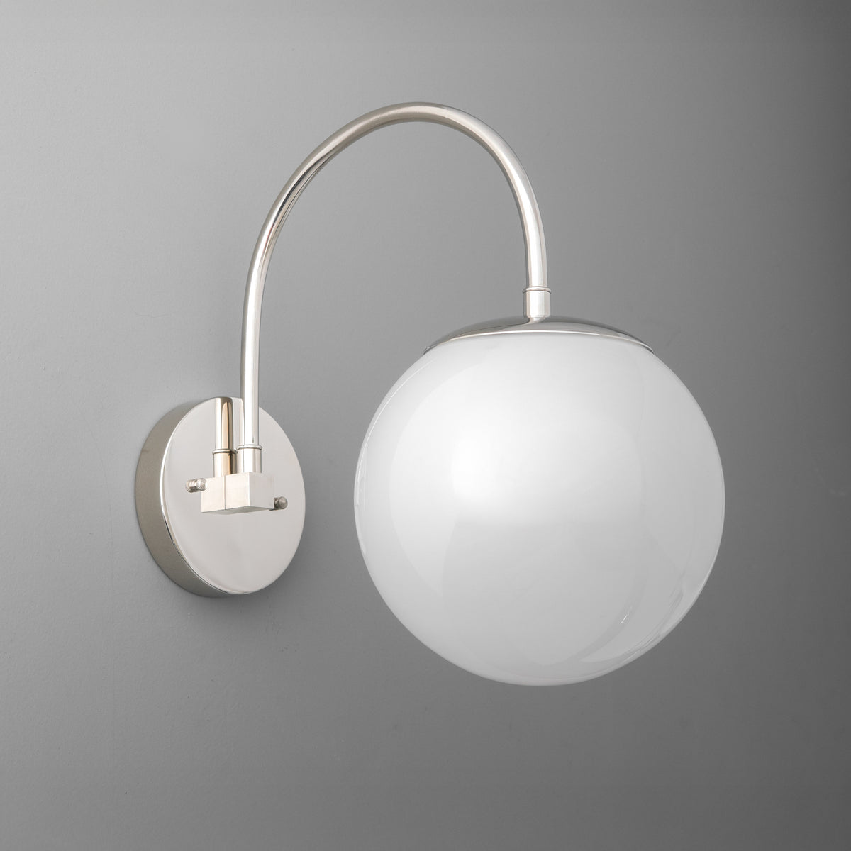 Polished nickel wall sconce with curved arm and white frosted glass globe shade. - SCONCE MODEL NO. 2947