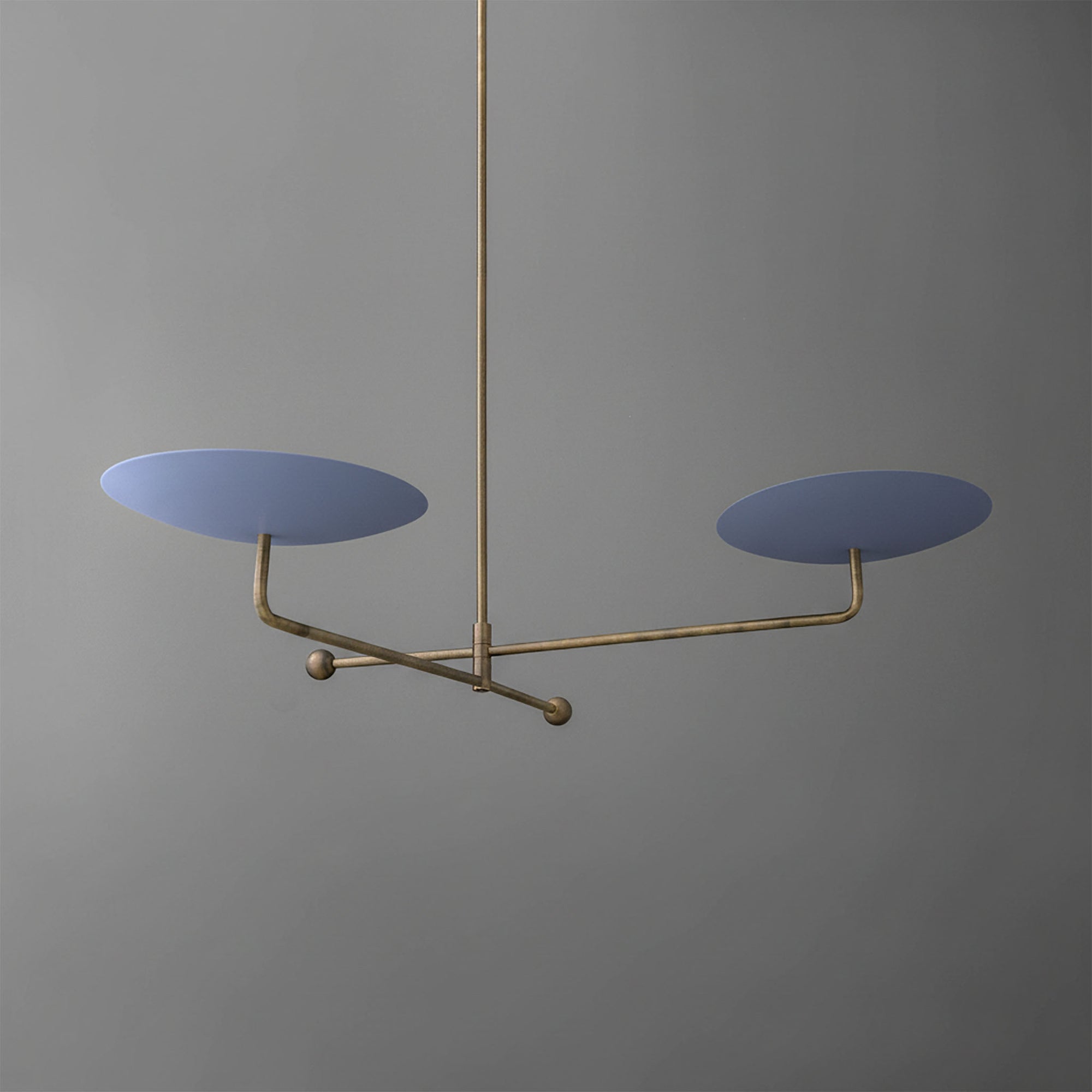 Modern chandelier with two matte blue disc-shaped shades on a thin brass frame suspended from brass rod. - CHANDELIER MODEL NO. 0680