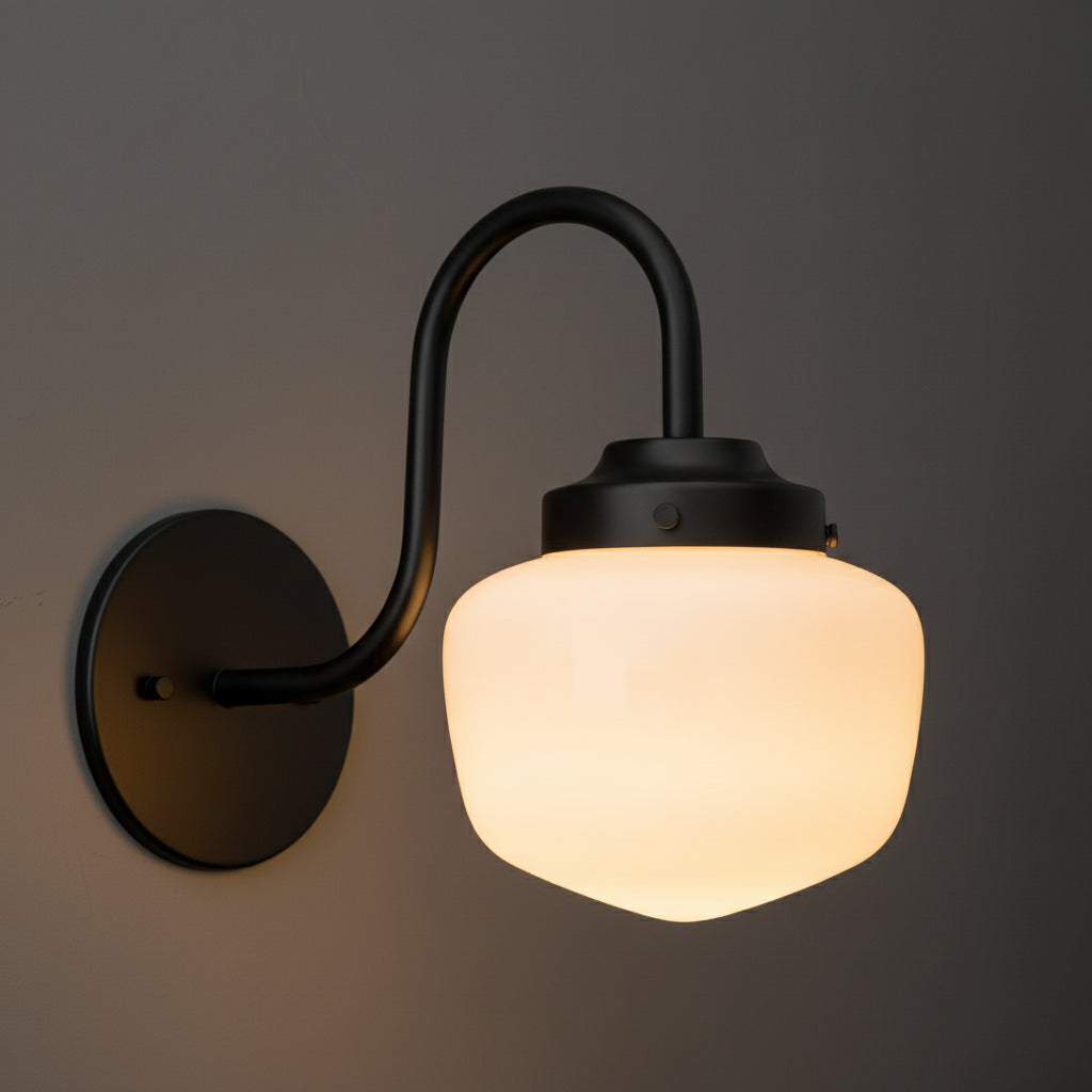 Matte black metal wall sconce with curved arm and frosted white glass shade. - SCONCE MODEL NO. 1012