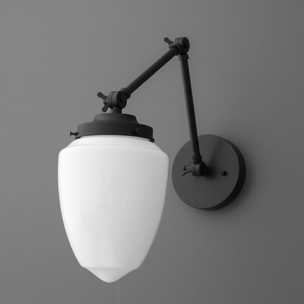 Black metal wall sconce with an angled arm and white frosted glass globe shade. - SCONCE MODEL NO. 2595