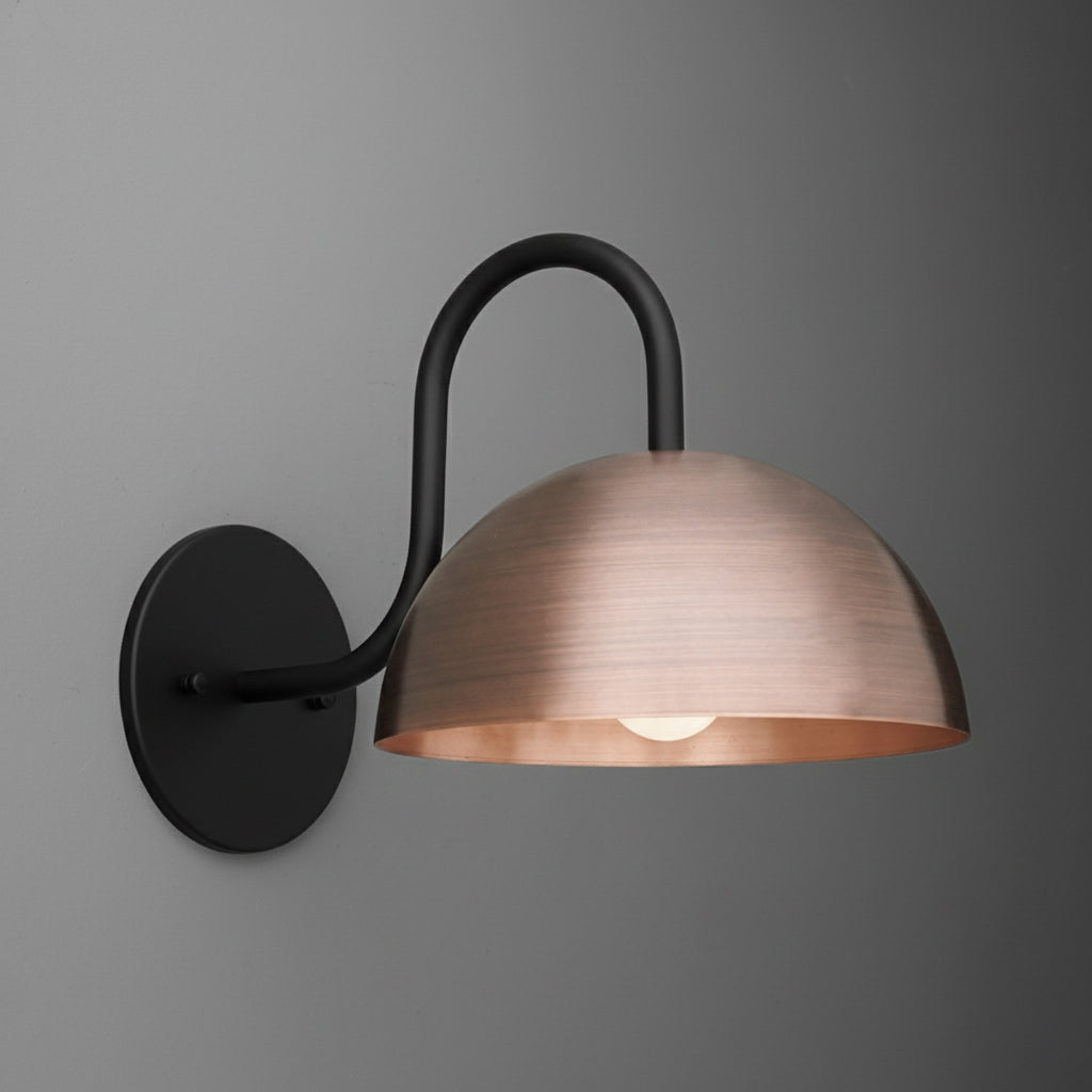 Wall-mounted sconce with matte black curved arm and brushed copper dome-shaped shade with exposed bulb. - SCONCE MODEL NO. 4008