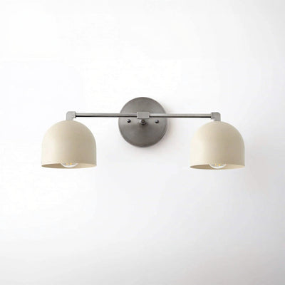 Two-bulb vanity light with brushed nickel finish and cream dome shades mounted on wall plate. - VANITY LIGHT MODEL NO. 0698
