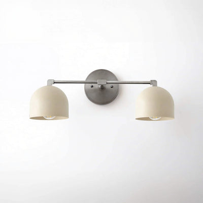Brushed nickel vanity light with two cream dome shades and minimalist round wall mount. - VANITY LIGHT MODEL NO. 0698