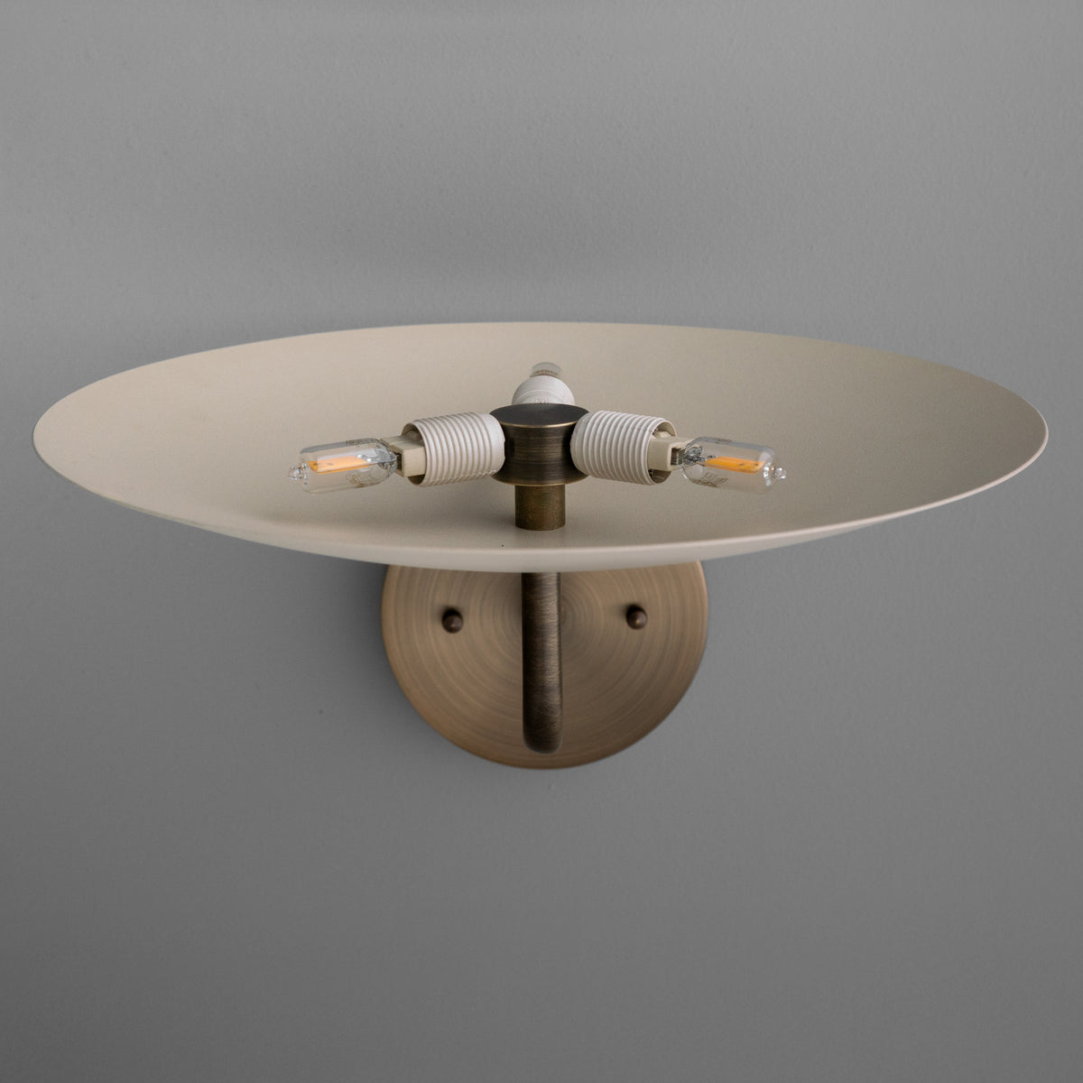 Brushed metal 3-bulb wall sconce with wide round shade and exposed filament bulbs. - SCONCE MODEL NO. 1504