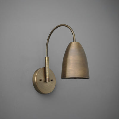 Antique brass wall sconce with curved arm and dome-shaped shade against gray background. - SCONCE MODEL NO. 2977