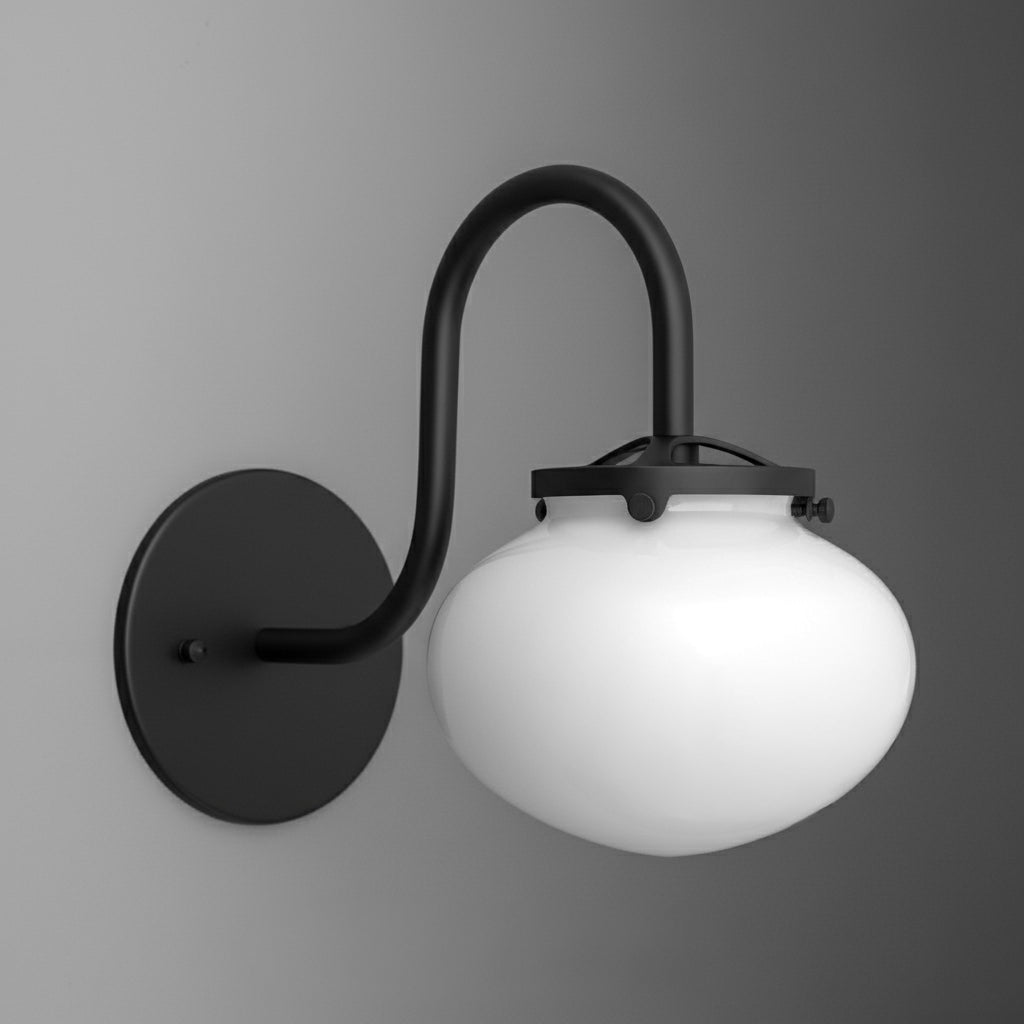 Matte black metal wall sconce with curved arm and frosted white glass globe shade. - SCONCE MODEL NO. 8563