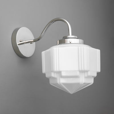 Wall-mounted silver metal sconce with curved arm and geometric white frosted glass shade. - SCONCE MODEL NO. 1058