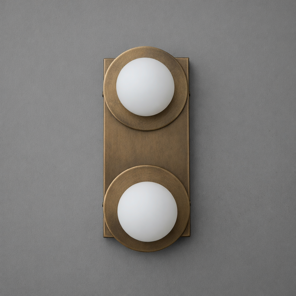Two-light sconce in Antique Brass with round plates and opal glass globes on a tall rectangular backplate. - SCONCE MODEL NO. 8828