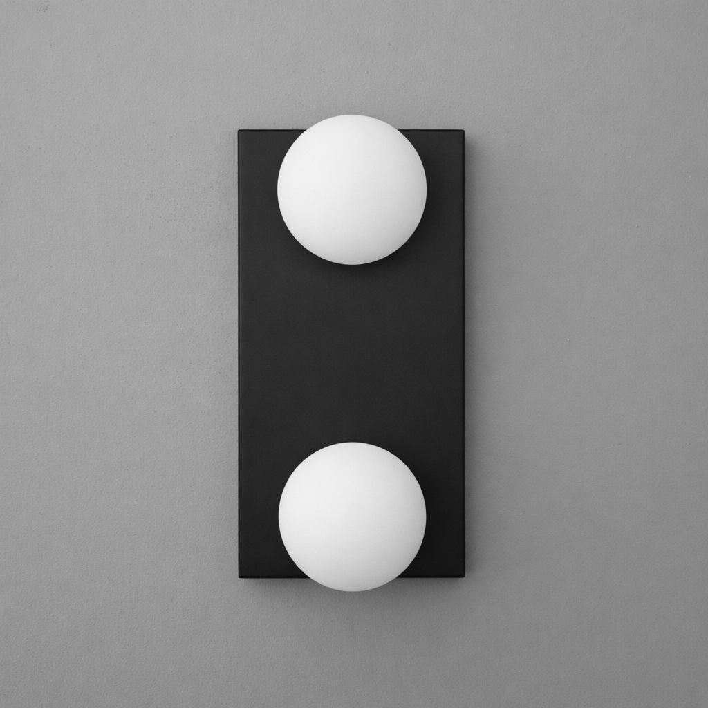 Black rectangular wall sconce with two white frosted glass globe bulbs vertically aligned. - SCONCE MODEL NO. 4016