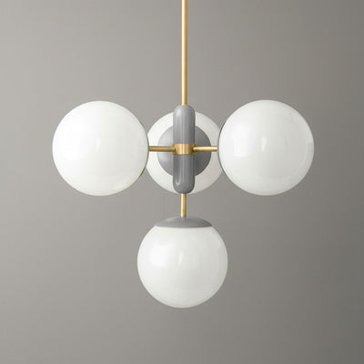 Art Deco chandelier with sealed brass fixture and three white globe lights against gray background. - CHANDELIER MODEL NO. 4321