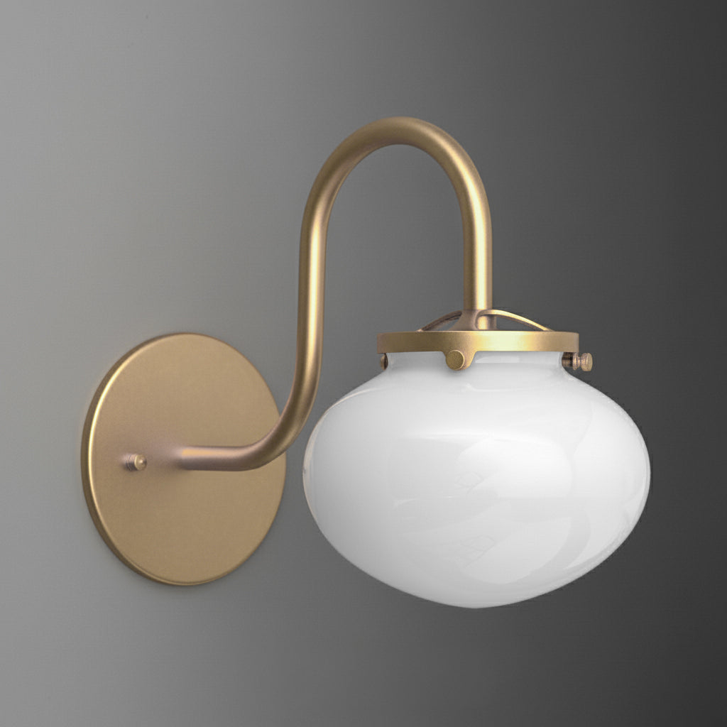 Wall sconce with brushed brass curved arm and round white glass shade. - SCONCE MODEL NO. 8563
