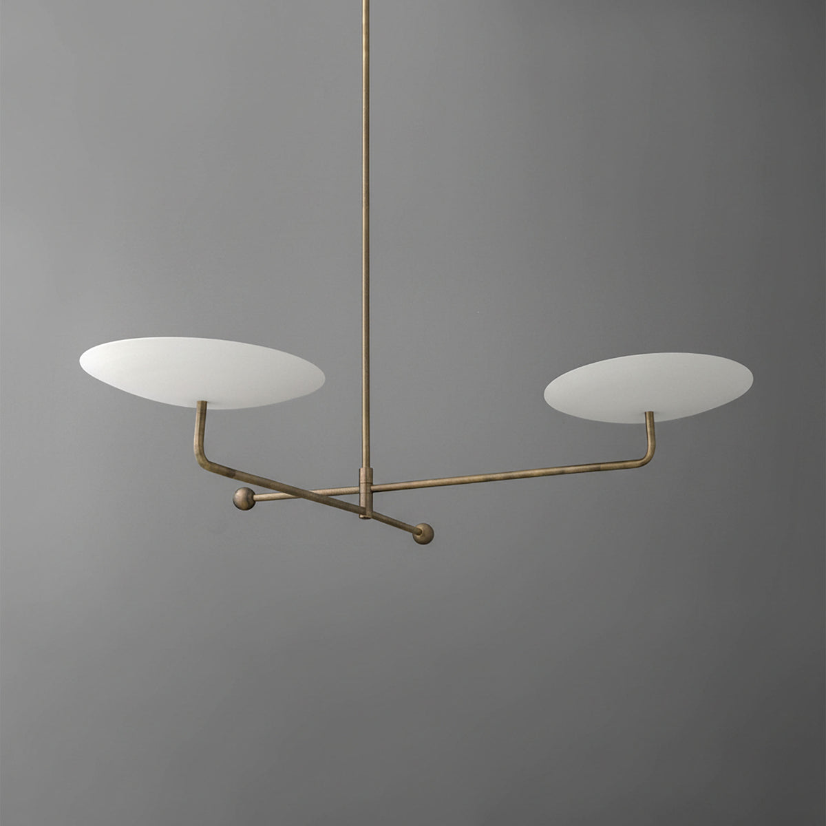 Modern brass chandelier with two flat white disc-shaped shades on a sleek horizontal frame. - CHANDELIER MODEL NO. 0680
