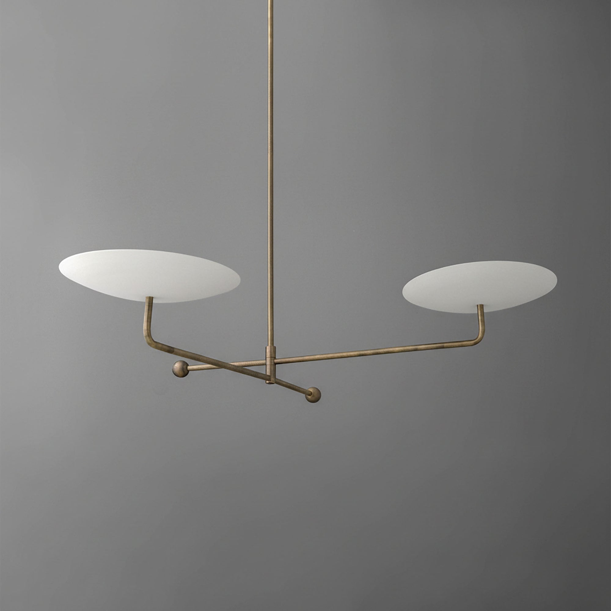 Modern brass chandelier with two flat white disc-shaped shades on a sleek horizontal frame. - CHANDELIER MODEL NO. 0680