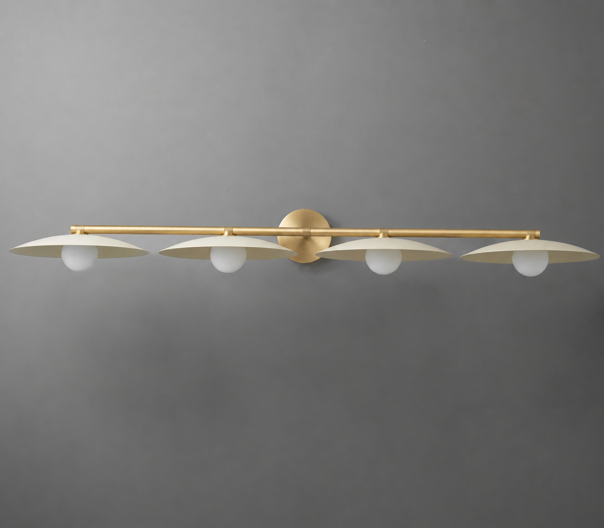 Matte gold four-bulb vanity light with round frosted glass shades and slim horizontal bar design. - VANITY LIGHT MODEL NO. 1152