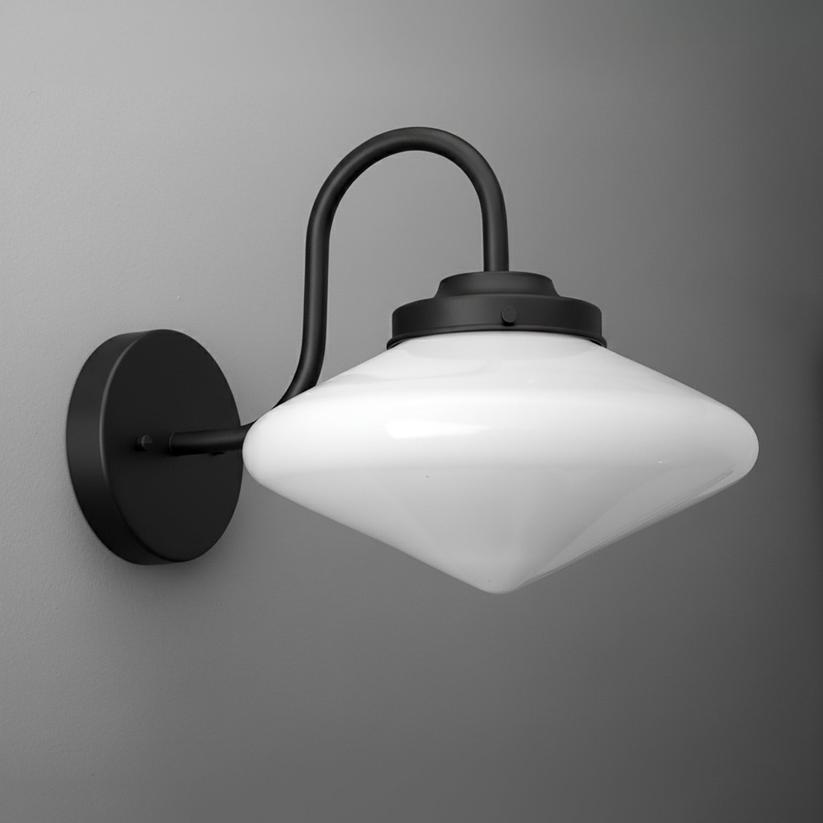 Black metal wall sconce with curved arm and white frosted conical glass shade. - SCONCE MODEL NO. 1021
