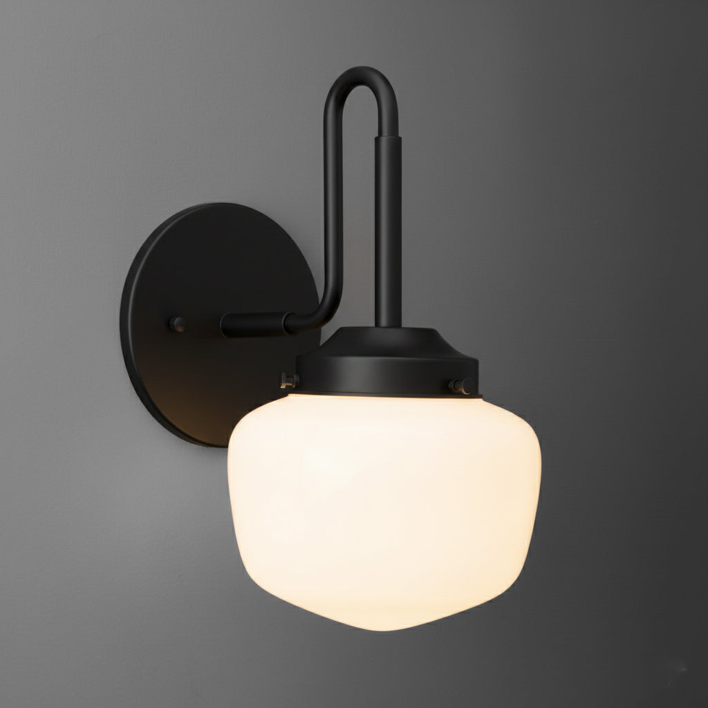 Matte black wall sconce with rounded frosted glass shade and minimalist curved arm design. - SCONCE MODEL NO. 1020