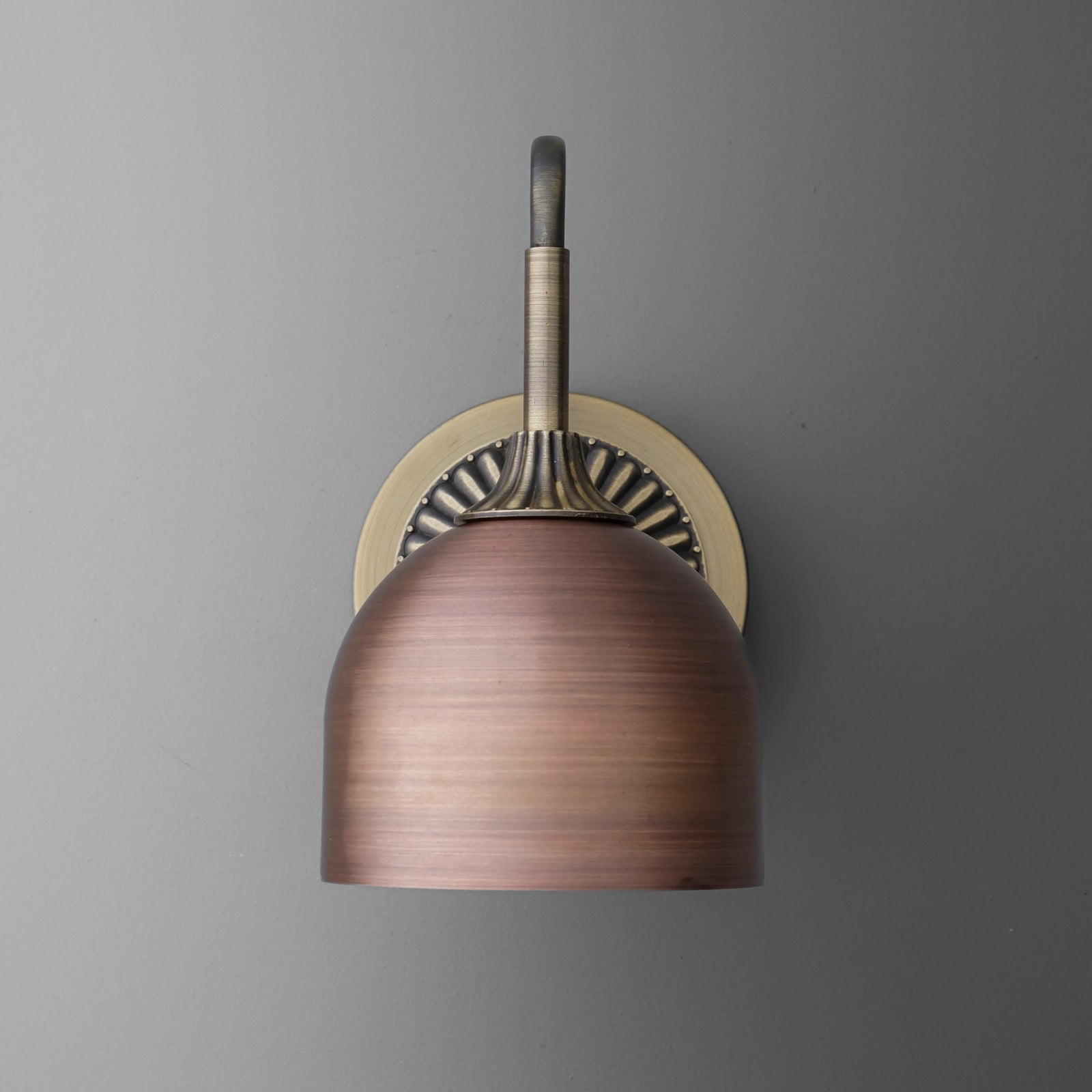Antique bronze wall sconce with dome-shaped shade and decorative round backplate. - SCONCE MODEL NO. 3046